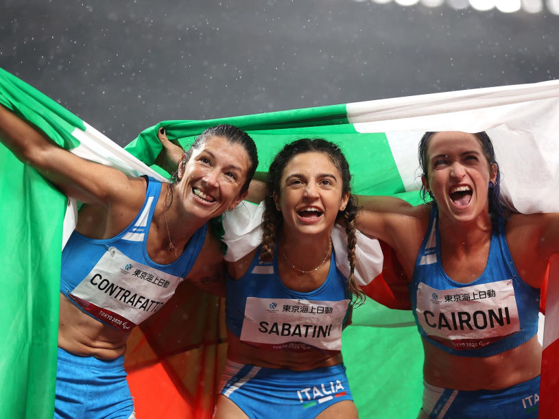 Women's T63 100 metre Medallists, from left, Monica Graziana Contrafatto, bronze, Ambra Sabatini, gold, and Martina Caironi, silver, all of Italy, celebrate after the race at the Olympic Stadium on day eleven during the Tokyo 2020 Paralympic Games in Tokyo, Japan